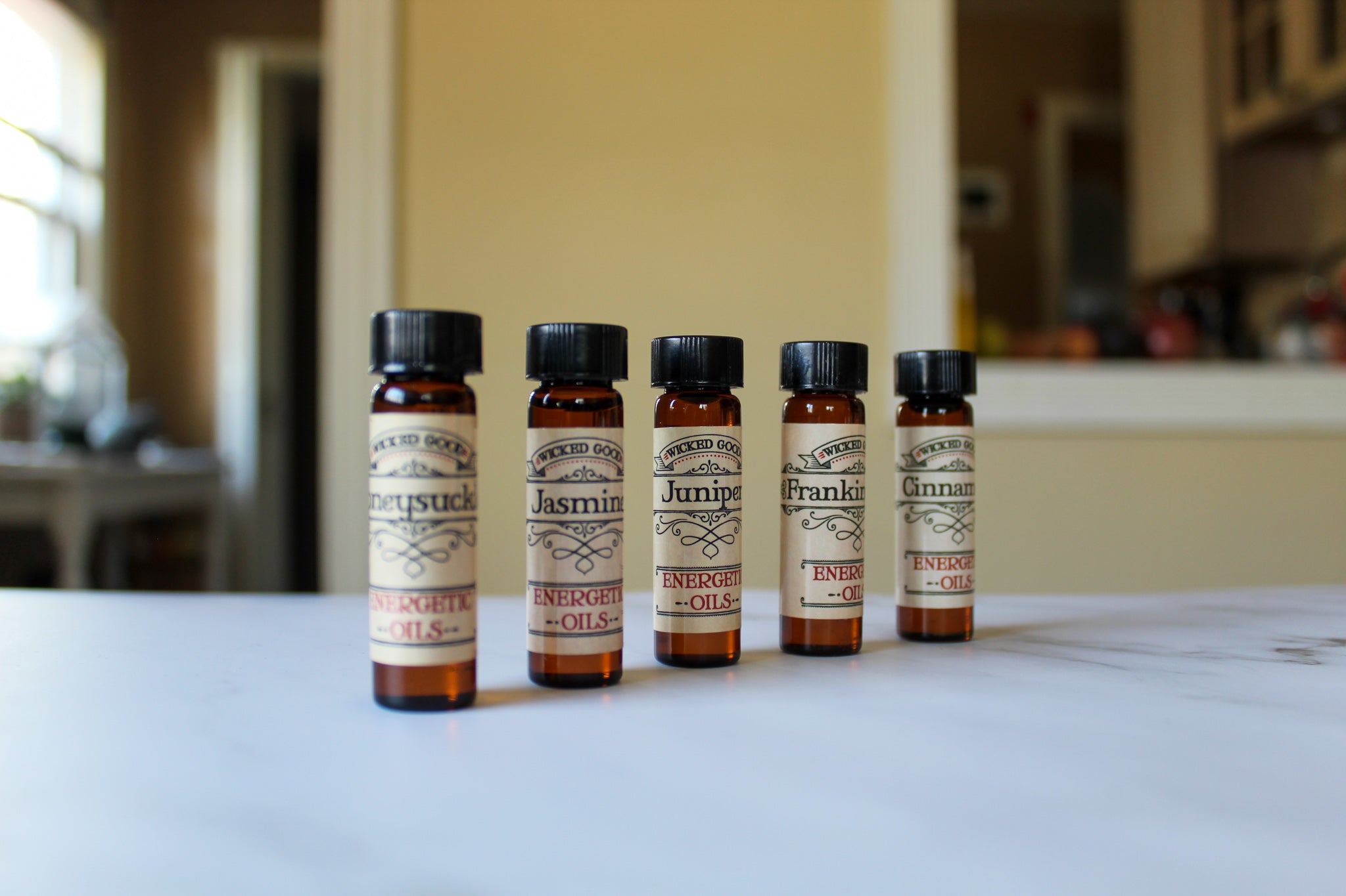 5 Coventry Creations Wicked Good Energetic Oil bottles. Honeysuckle, Jasmine, Juniper, Frankincense, and Cinnamon.