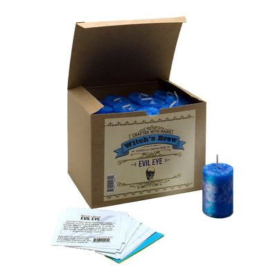 Coventry Creations Witch’s Brew Evil Eye Brilliant Blue Votive Candles in a box with one votive out