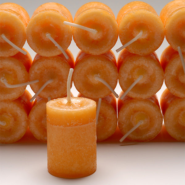 Coventry Creations Blessed Herbal Energy and Will Power Votive Orange candles stacked with one candle in front