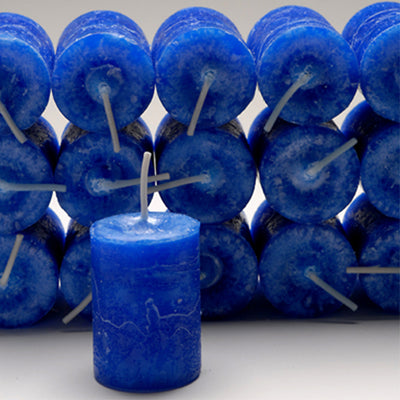 Coventry Creations Blessed Herbal Truth and Justice Brilliant Blue Power Votive Candles stacked with one candle in front